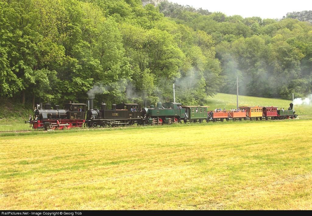 CH Oensingen-Balsthal-Bahn is leading a unique train of vintage vehicles from Oensingen to Balsthal 